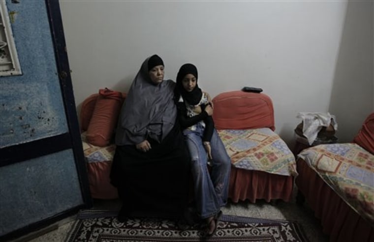 Samiha Mohammed, 65, left, the mother of late Mariam Hawas and her granddaughter Iman Bayyoumi, 12 sit at the family house in Talkha, Mansoura, Egypt. 